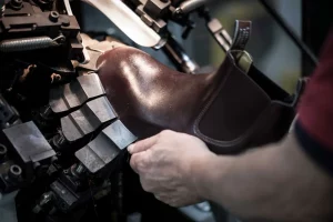 Close up of R.M.Williams employee repairing a boot