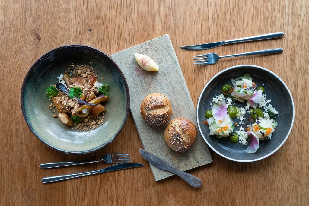 Two meals with bread prepared at The Currant Shed