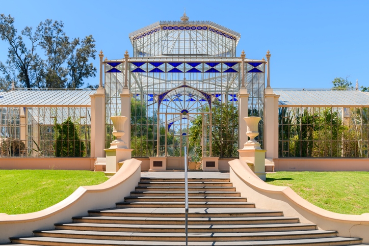 Adelaide, South Australia - December 22, 2022: 1877 tropical palm house main entrance with stairs in Adelaide Botanic Garden viewed on a day