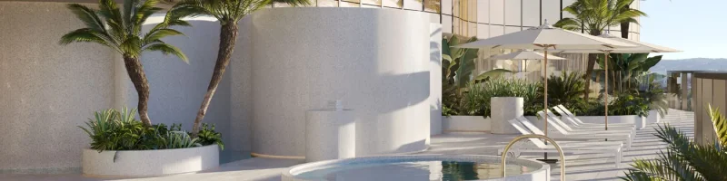 Outdoor deck area at Eos by SkyCity with pool and loungers