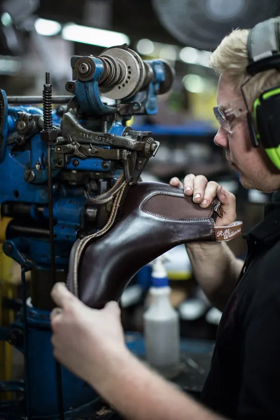 R.M.Williams employee repairing a boot in the workshop